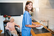 © zinkevych - Care assistant cleaning the kitchen after breakfast