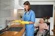 © zinkevych - Care assistant cleaning the kitchen after breakfast