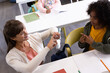 © Wavebreak Media - In school, female teacher using sign language with boy, fostering communication skills