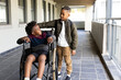 © Wavebreak Media - Diverse boys supporting each other in school hallway, smiling and enjoying friendship