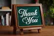 © JARA - A rustic wooden easel chalkboard displaying a thank you message