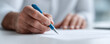 © SolaruS - Closeup of a hand signing a document with a pen. Represents agreement, authorization, or commitment. Use for legal, business, or personal finance themes.
