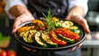 © Stanislava - Carefully Aligning Grilled Vegetables in Fan Shape. Food Prep Macro Shot