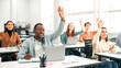 © Prostock-studio - Presentation, Convention Concept. Portrait of smiling international people participating in seminar at modern office, raising hands up to ask question or to volunteer, diverse group sitting at tables