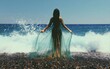 © Ginimo - Woman in flowing dress by the ocean