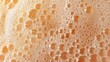 © sablengjago - Close-up of orange liquid with many bubbles, foam texture background.