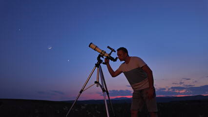 Canvas Print - amateur astronomer using telescope for watching stars, moon, planets and other celestial objects fro