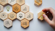 © Parradee - Design Thinking Process concept. Wooden blocks with icons; the key stages of the design thinking process, a solution-focused, problem-solving methodology used for innovation and strategic development.