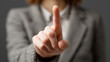 © Anthichada - Close up of a businesswoman hand with pointer finger extended upward and rest of hand