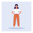 © Nabil - A woman stands confidently with hands on hips wearing a white tee and orange pants