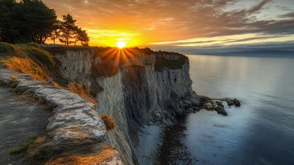 Wall Mural - A scenic view of the ocean from the top of a cliff, perfect for use in travel or adventure themed projects.