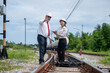 © APchanel - Engineer manager and a secretary working together railway track during inspection or routine maintenance gas or oil power industrial or transportation setting the rail train import export logistics.