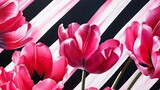 Vibrant pink tulips on a black and white diagonal striped background