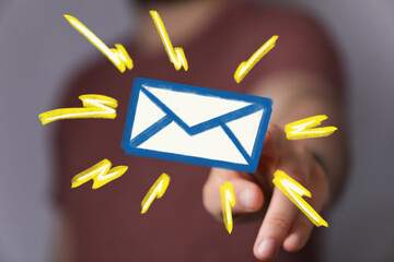 Hand pointing at glowing email icon.  Perfect for marketing, communication, and technology concepts.