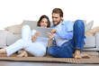 © ty - Happy couple sitting and planning new home decoration at home with a tablet, renovation and interior design for new house on a transparent background