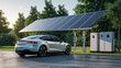 © ellinanova - Electric car charging with solar panels in nature