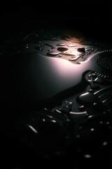 Wall Mural - Abstract dark metallic surface with intricate patterns