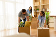 © BGStock72 - Family enjoys unpacking boxes while moving into their new home, filled with laughter and joy in the bright living room