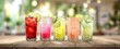 © MP Studio - The vibrant array of colorful cocktails on a wooden countertop.