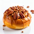 © Ossi - Delicious caramel donut adorned with pecans, a sweet treat on white background
