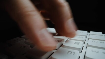 Wall Mural - close-up man typing on computer keyboard with hands and fingers. macro soft focus dolly shot. comput