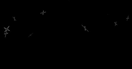 Wall Mural - an explosion of abstract fireworks, the scattering of particles in the form of four-pointed stars. a