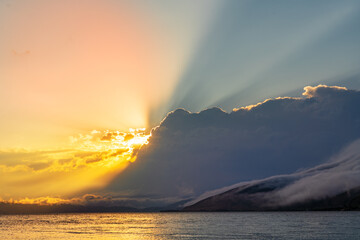 Wall Mural - Beautiful sunset with clouds over the lake.