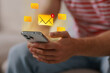© New Africa - Email marketing, new message notification. Man using mobile phone indoors, closeup