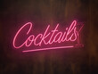 © Image soup - Pink Neon “Cocktails” Sign on Dark Wall