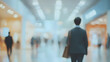 © safu designe - blurred bussines people walking at a trade fair comerce, background with copyspace