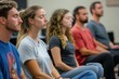 © At My Hat - A diverse group sits in meditation with closed eyes. This image shows mindfulness, stress reduction, and wellness.