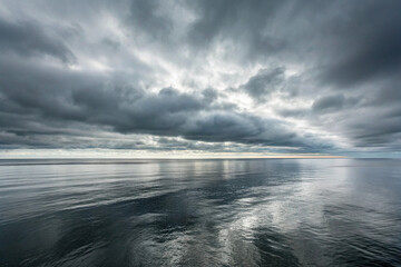 Wall Mural - Dramatic Cloudy Sky Over Calm Ocean – Moody Seascape Horizon Reflection