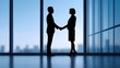 © pkproject - Business professionals shaking hands in a corporate office setting