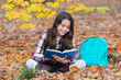 © be free - School girl reading book outdoor. Teen girl reading in the autumn park. Education and knowledge. Knowledge day. Self education. Autumn book. Back to school. School education. Reading poem