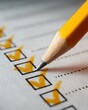 © Somporn - Close-Up of Yellow Pencil Marking Checked Boxes on Checklist Paper in Soft Light for Task Completion or Organization Themes
