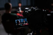 © ADDICTIVE STOCK - Podcast recording setup with camera and host view