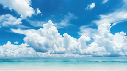 Wall Mural - A serene coastal scene with a wide sandy beach, clear blue sky, and white clouds