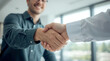 © Ada - Two happy diverse professional business men executive leaders shaking hands at office meeting. Smiling businessman standing greeting partner with handshake. Leadership, trust, partnership concept