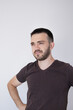 © Kateryna - Portrait of an young man  in doubt on the light gray background.