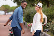 © auremar - happy funny young couple riding on bicycle