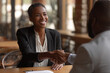 © mattegg - Smiling businesswoman shaking hand during meeting
