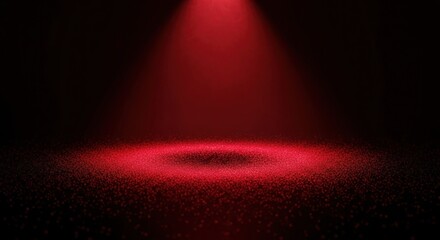 Wall Mural - A dramatic red spotlight illuminates a dark textured surface creating a theatrical and intense atmosphere