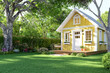 © onzon - Animation of cute tiny yellow house with empty green lawn 3d render Surrounded by nature.