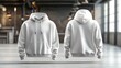 © oio - front and back view of plain white hooded sweatshirt displayed in modern industrial indoor setting