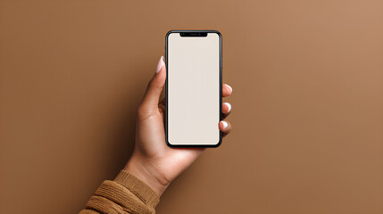 Wall Mural - hand holding smartphone mockup with blank screen on brown background