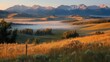 © Nusaibah - Sunrise mist over rolling hills and mountains