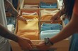 © Kavi Megh - People packing clothes into a suitcase for a vacation trip, organizing their outfits in preparation for travel., Generative AI