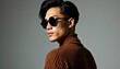 © Zoe - Modern Urban Style An Attractive Man of East Asian Descent in a Ribbed Sweater and Sunglasses