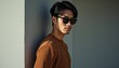 © Zoe - Modern Urban Style An Attractive Man of East Asian Descent in a Ribbed Sweater and Sunglasses