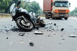© photo for everything - Motorcycle wreck on the highway. A dark motorcycle lies in pieces on the pavement after a crash. A large truck idles in the background.